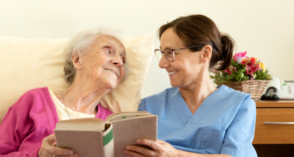 patient and nurse reading